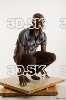 Kneeling reference of whole body black white striped shirt brown…